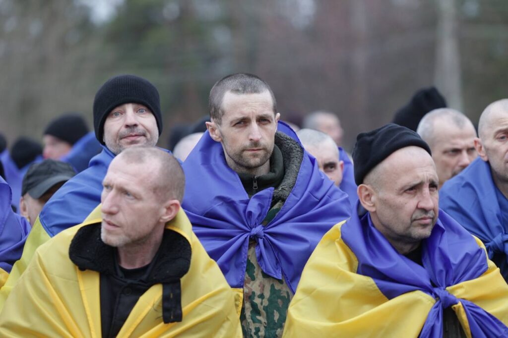 ukraine brings home 300 more soldiers two civilians second day pow swap — 500 freed total over days · post ukrainian prisoners war wrapped national flags after geneva-agreed exchange 6