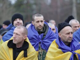ukraine brings home 300 more soldiers two civilians second day pow swap — 500 freed total over days · post ukrainian prisoners war wrapped national flags after geneva-agreed exchange 6