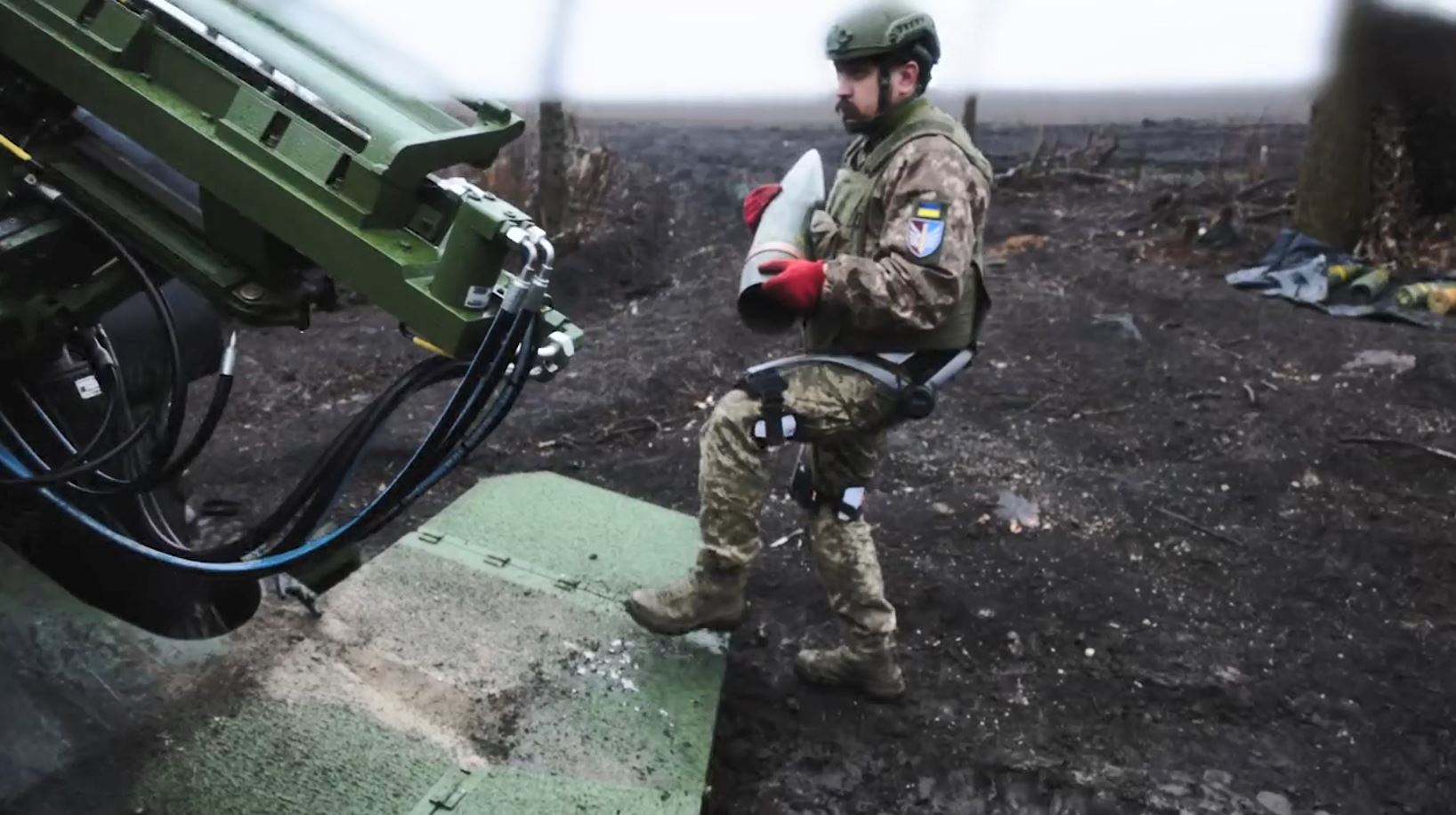 gunners can carry small car's weight shells every day — ukraine fields exoskeletons pokrovsk front · post soldier 147th separate artillery brigade wearing exoskeleton carries round loading arm caesar howitzer