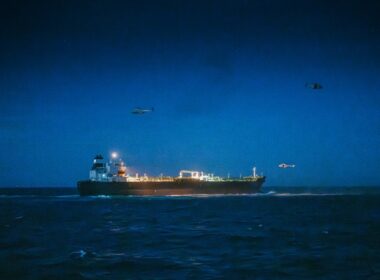 A sanctioned Russian "shadow fleet" oil tanker in the North Sea as military helicopters hover overhead during a joint Belgian-French operation to board and seize the vessel. Photo: Theo Francken