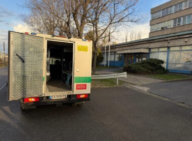 Rear view of an Oschadbank armored cash-in-transit vehicle with doors open and cargo compartment empty, returned by Hungary on 12 March 2026 with documented equipment damage.