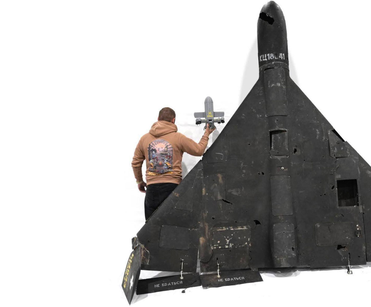 qatar want ukraine's shahed killers zelenskyy wants patriot missiles return · post man holds sting interceptor drone costing $2100 reaching up 343 km/h next downed russian shahed-136 scale sting-interceptor-drone-by-wild-hornets early-stage