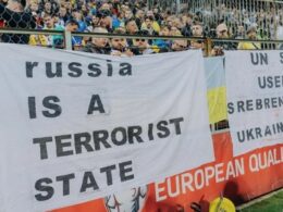 Ukrainian fans are holding the banner that reads "Russia is a terrorist state". Source: UAF