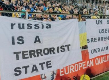 Ukrainian fans are holding the banner that reads "Russia is a terrorist state". Source: UAF