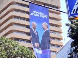 title · post election poster likud party headquarters israeli prime minister benjamin netanyahu russian president vladimir putin shaking hands hebrew text reads another league tel aviv israel 28 2019 tal
