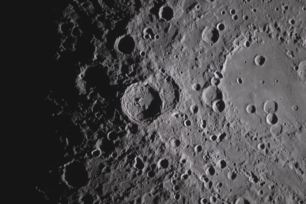The image from the Artemis II crew, showing the Orientale basin on the right edge of the lunar disk. NASA