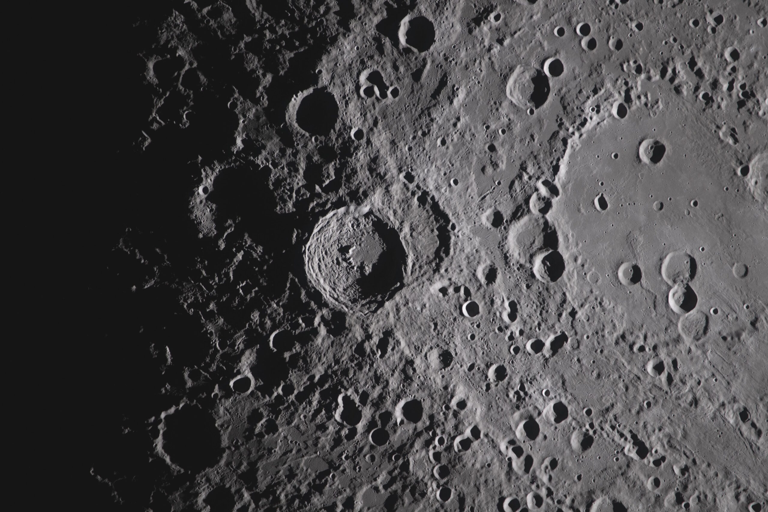 The image from the Artemis II crew, showing the Orientale basin on the right edge of the lunar disk. NASA