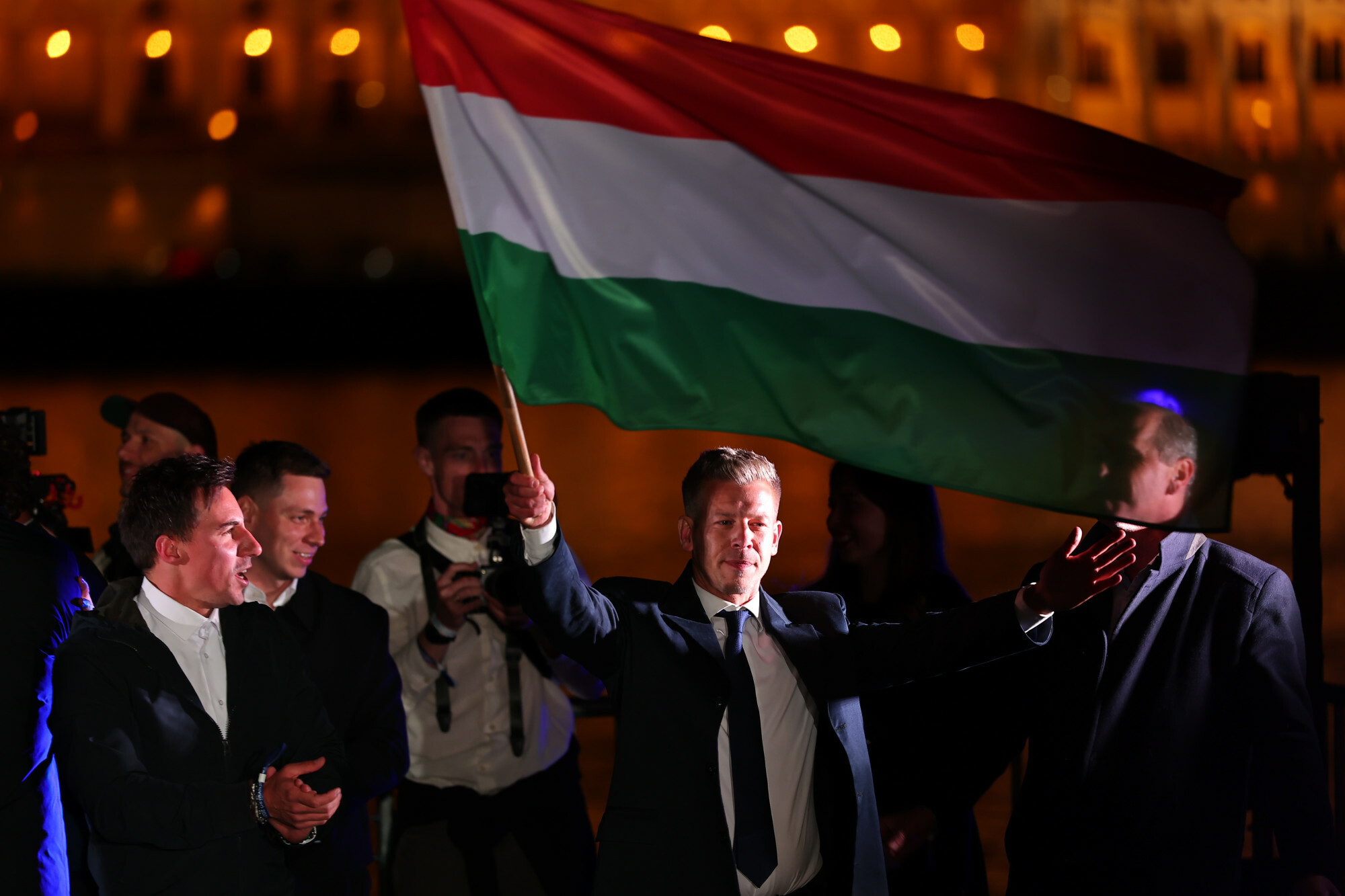 Péter Magyar waves the Hungarian flag at Tisza party's supermajority victory rally in Budapest, 12 April 2026