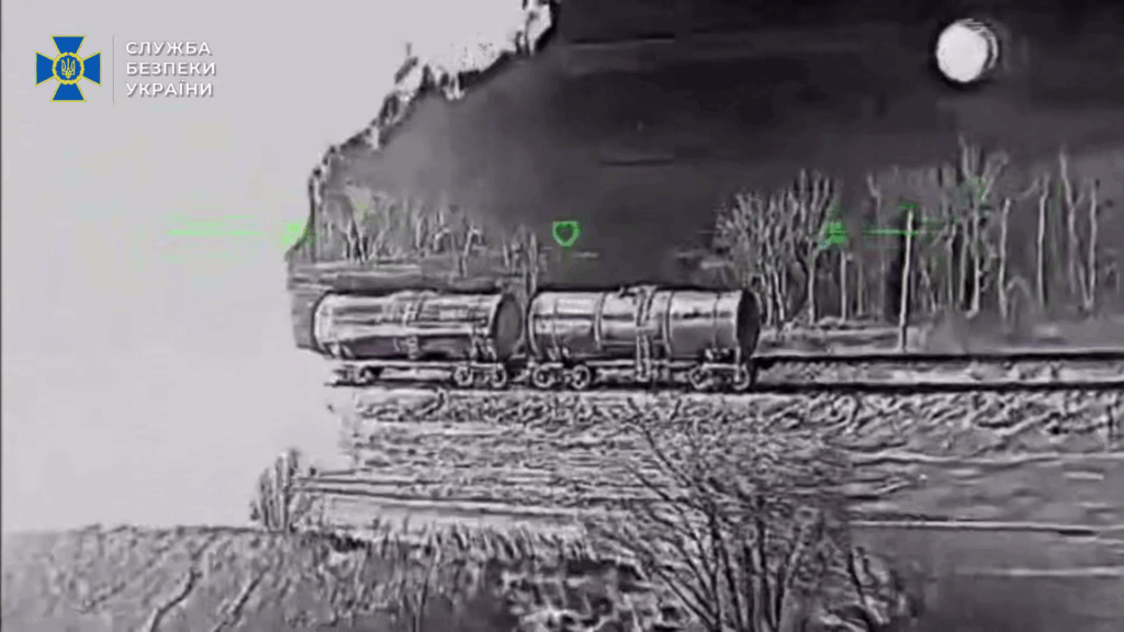 SBU Ukrainian drone strikes Luhansk Oblast Russian fuel tanker seen by a Ukrainian drone, with others on fire from previous strikes nearby.