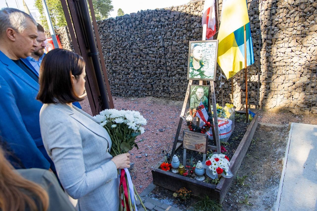 belarus's exiled opposition leader holds first ever kyiv visit free — minsk train ticket reads · post sviatlana tsikhanoŭskaya lays flowers grave fallen belarusian volunteer maryia zaitsava 25 2026 святлана