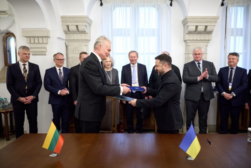 lithuania signs full drone deal latvia receives ukrainian air defense experts · post lithuanian president gitanas nausėda (left) volodymyr zelenskyy exchange signed agreement copies bucharest nine summit 13 2026 presidentgovua