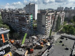 russia destroyed section 9-storey kyiv apartment block overnight killing two wounding 32 one war's largest combined attacks · post 9-story residential building kyiv's darnytskyi district after russia's strike side 14