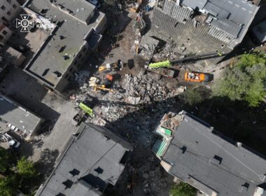 russia destroyed section 9-storey kyiv apartment block overnight killing two wounding 32 one war's largest combined attacks · post rescuers clear rubble site collapsed side kyiv's darnytskyi district after russia's