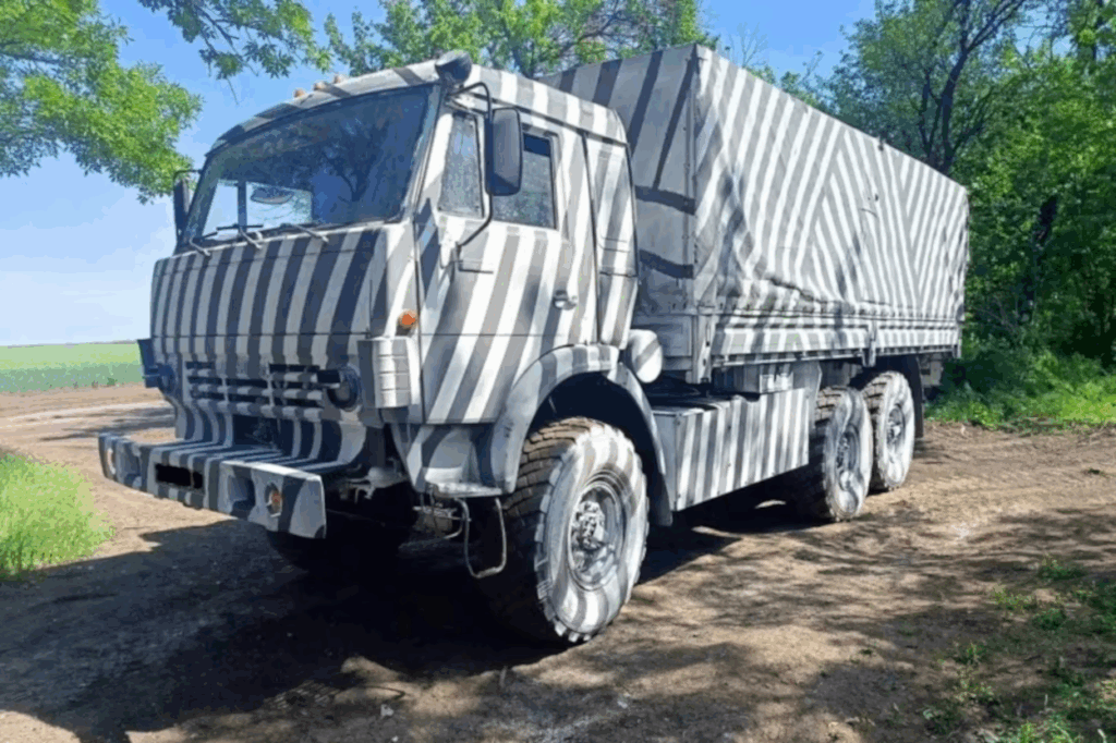 Russian military vehicle with zebra-like paint patterns in an attempt to disrupt AI-assisted drone targeting systems. Photo from social media, via RFE/RL.