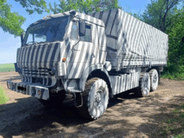 Russian military vehicle with zebra-like paint patterns in an attempt to disrupt AI-assisted drone targeting systems. Photo from social media, via RFE/RL.