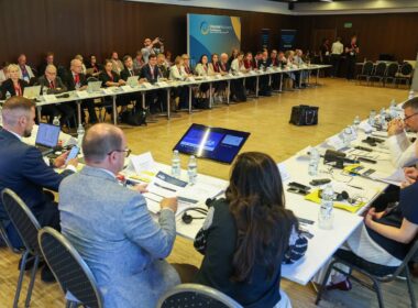 Panel discussion at the Ukraine Recovery Conference 2026 in Gdańsk, with speakers on stage and attendees in the audience