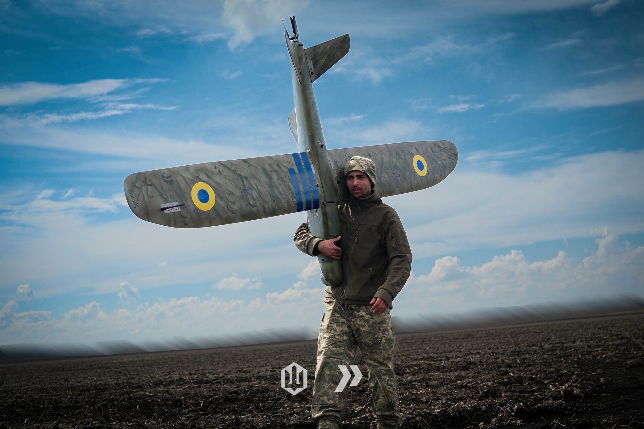 The image shows a Ukrainian soldiers with an unmanned aerial vehicle. Source: The 413th Regiment