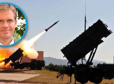 A Patriot air-defense system launches an interceptor, with an inset portrait of defense scholar Marc DeVore — illustrating Ukraine's interceptor shortage.