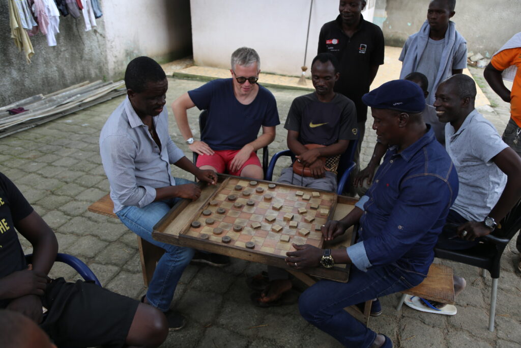 janek mäggi playing draughts in abidjan, ivory coast