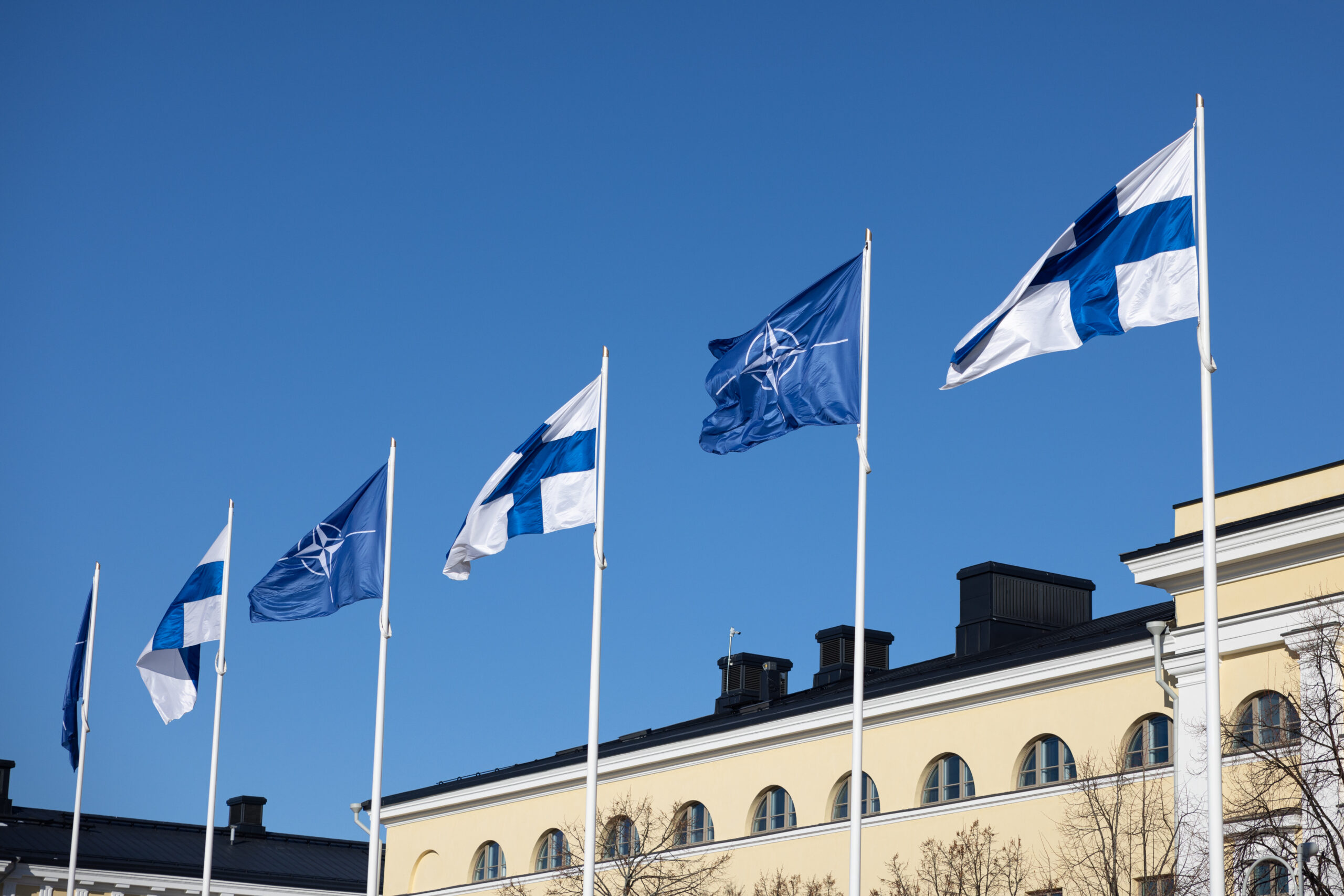 Flags of Finland and NATO. Photo via Wikimedia Commons