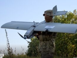 A Ukrainian service member holds a Darts attack drone, which has a reported range of 40-60 kilometers. Russian military sources say that these are among the Ukrainian drones that mount a directional antenna that can dynamically maintain connection with a signal repeater. (Photo: Come Back Alive Foundation)