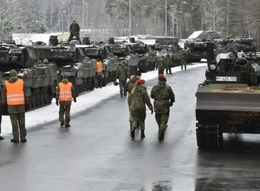 Bundeswehr troops and armored vehicles support NATO's eFP Battlegroup in Lithuania, part of Germany's posture against Russian hybrid attacks.