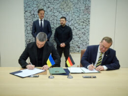 Ukrainian Defense Minister Mykhailo Fedorov and German Federal Defense Minister Boris Pistorius signing agreements on the development of anti-ballistic capabilities and the joint production of UGVs, in Brussels, 18 June 2026. Photo: Ukrainian President's Office