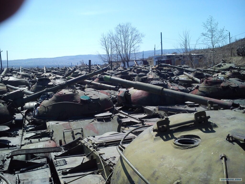 Rows of Soviet-era T-54/T-55 tanks in long-term storage.