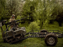 The image shows a Ukrainian soldier standing next to an unmanned ground robotic vehicle. Source: The General Staff