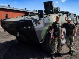 Ukrainian soldiers are standing next to Rosomak APCs at a Polish military base. Credit: Ukraine's 146th Separate Repair-Restoration Regiment