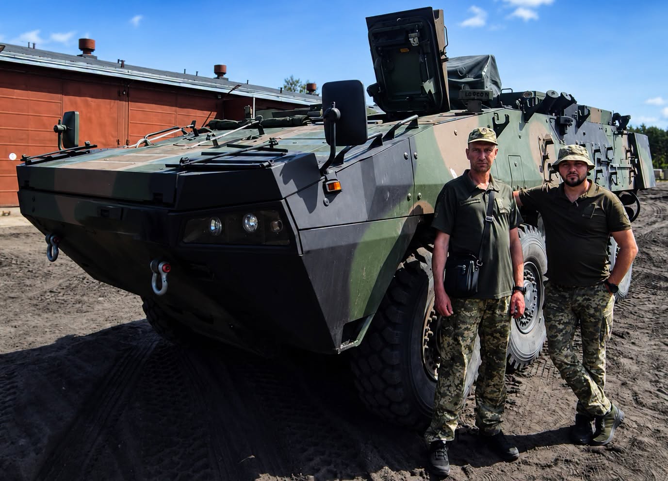 Ukrainian soldiers are standing next to Rosomak APCs at a Polish military base. Credit: Ukraine's 146th Separate Repair-Restoration Regiment