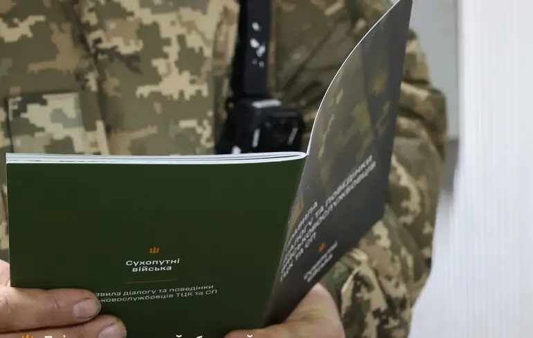 investigators descend ukraine's recruitment offices coordinated nationwide operation · post serviceman holds ukrainian ground forces booklet standards conduct recruitment-center staff facebook/dnipropetrovsk oblast territorial center img soldier дніпропетровський обласний тцк та