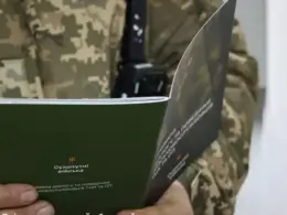 investigators descend ukraine's recruitment offices coordinated nationwide operation · post serviceman holds ukrainian ground forces booklet standards conduct recruitment-center staff facebook/dnipropetrovsk oblast territorial center img soldier дніпропетровський обласний тцк та