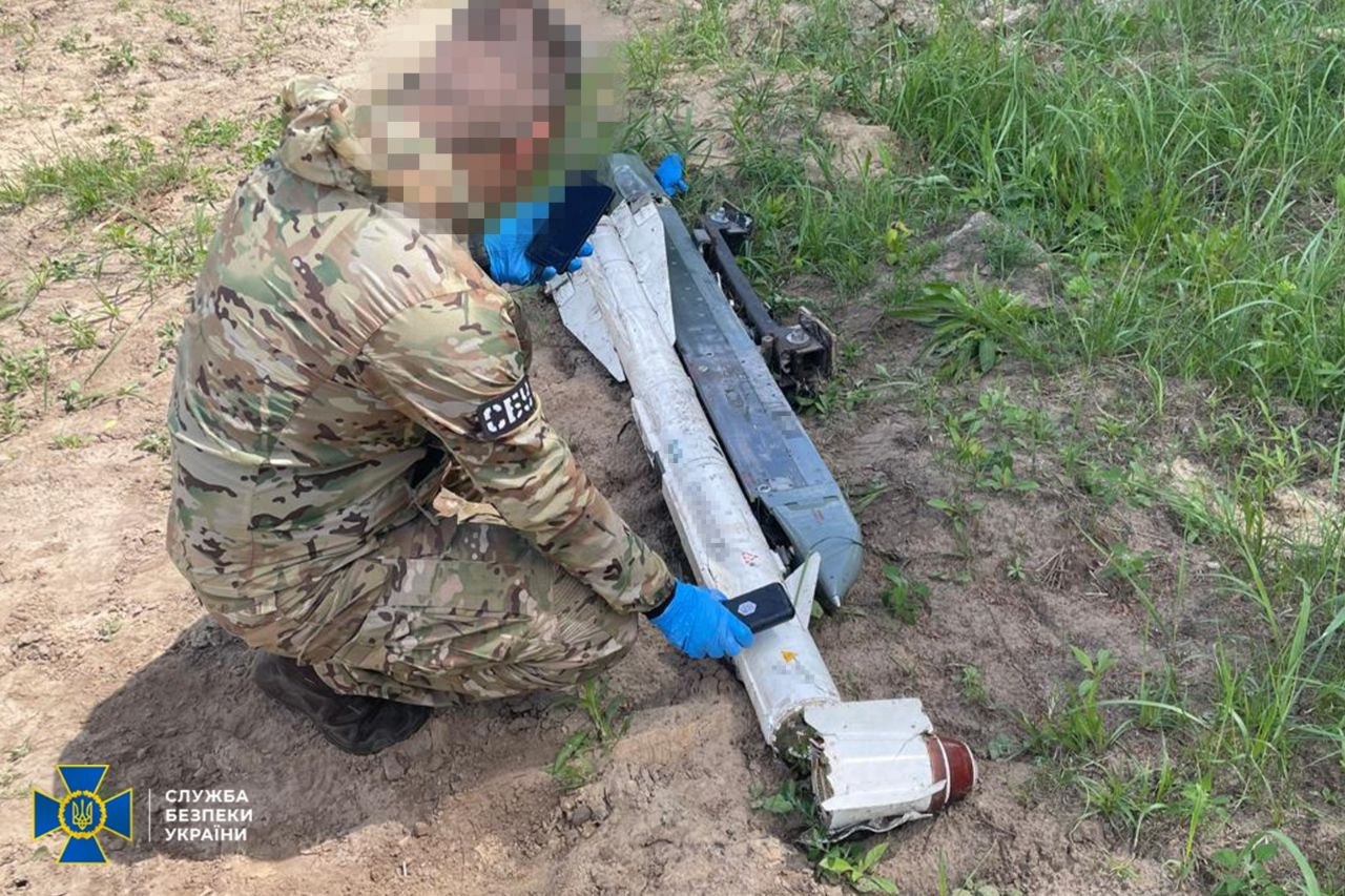 A Ukrainian Security Service officer at the crash site of a Russian drone containing uranium. Source: The SBU