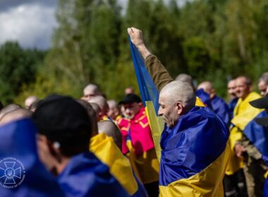 two officers 101 soldiers—ukraine's newest homecoming russian cells · post freed ukrainian defender raises fist among fellow released captives wrapped national flags 19 2026 4 pow exchange sbu5199714552638020898 ukraine news