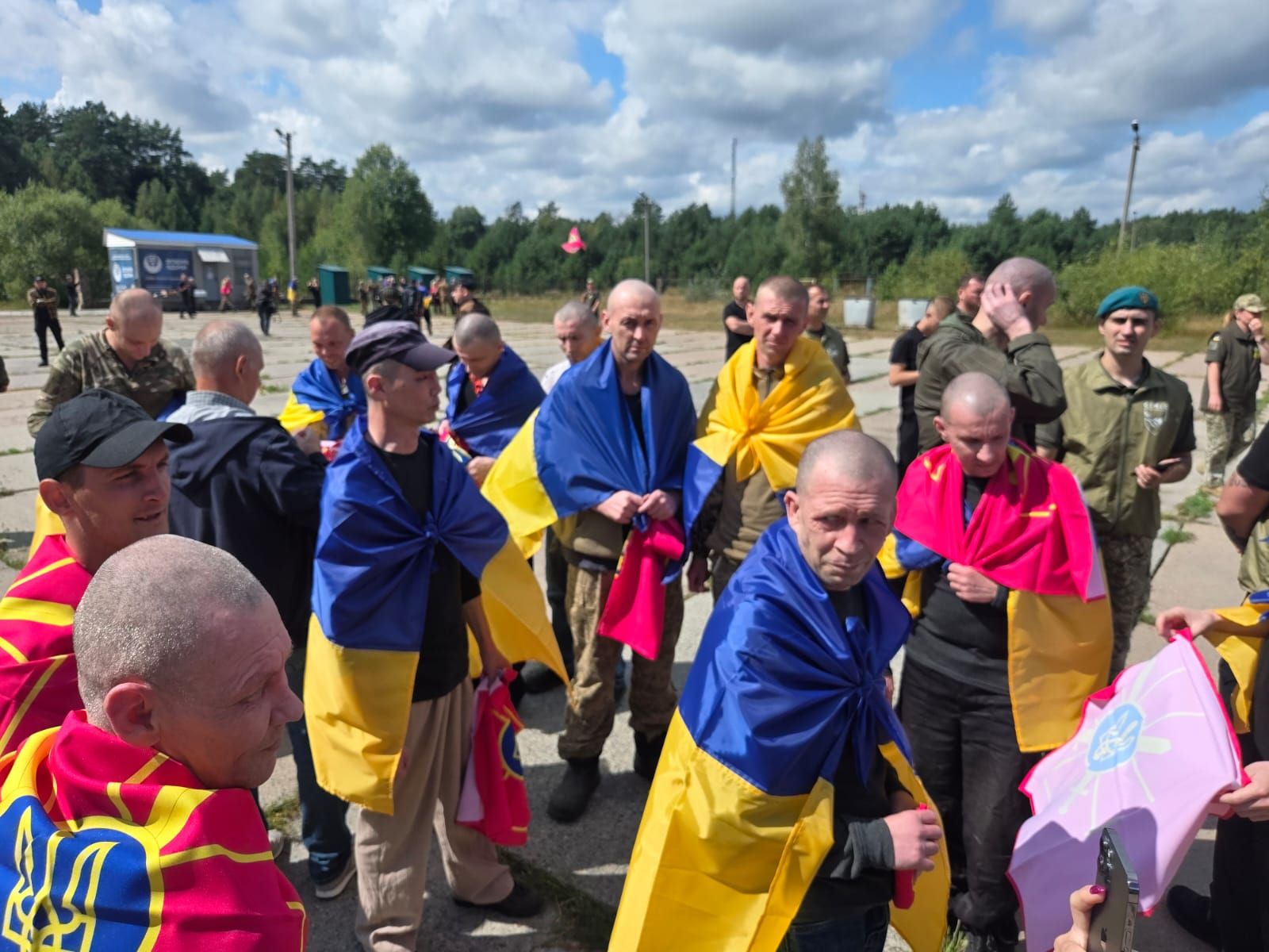 two officers 101 soldiers—ukraine's newest homecoming russian cells · post freed ukrainian servicemen wrapped national flags gather after returning captivity 19 2026 5 pow exchange координаційний штаб ukraine news reports