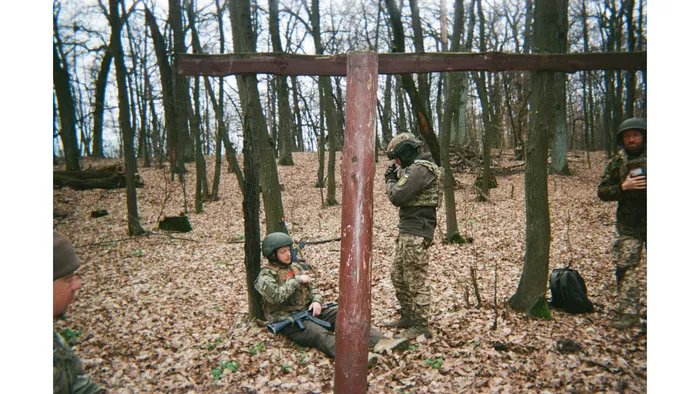 Ukrainian service members rest in a wooded area near the front, 2025. Photo: project participant Danylo “Doc”