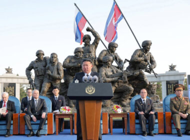 North Korean leader Kim Jong-un speaks at the opening of a memorial in Pyongyang, with Russia's Defense Minister Andrei Belousov and State Duma Speaker Vyacheslav Volodin seated behind him. April 2026. Illustrative photo: KCNA