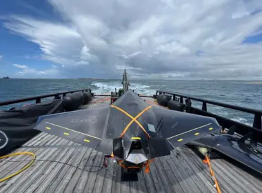 Black Nyan one-way attack drone secured to a launcher on the deck of a Royal Navy vessel at sea.