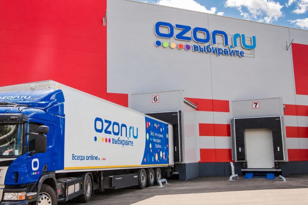 ozon delivery truck outside of a warehouse