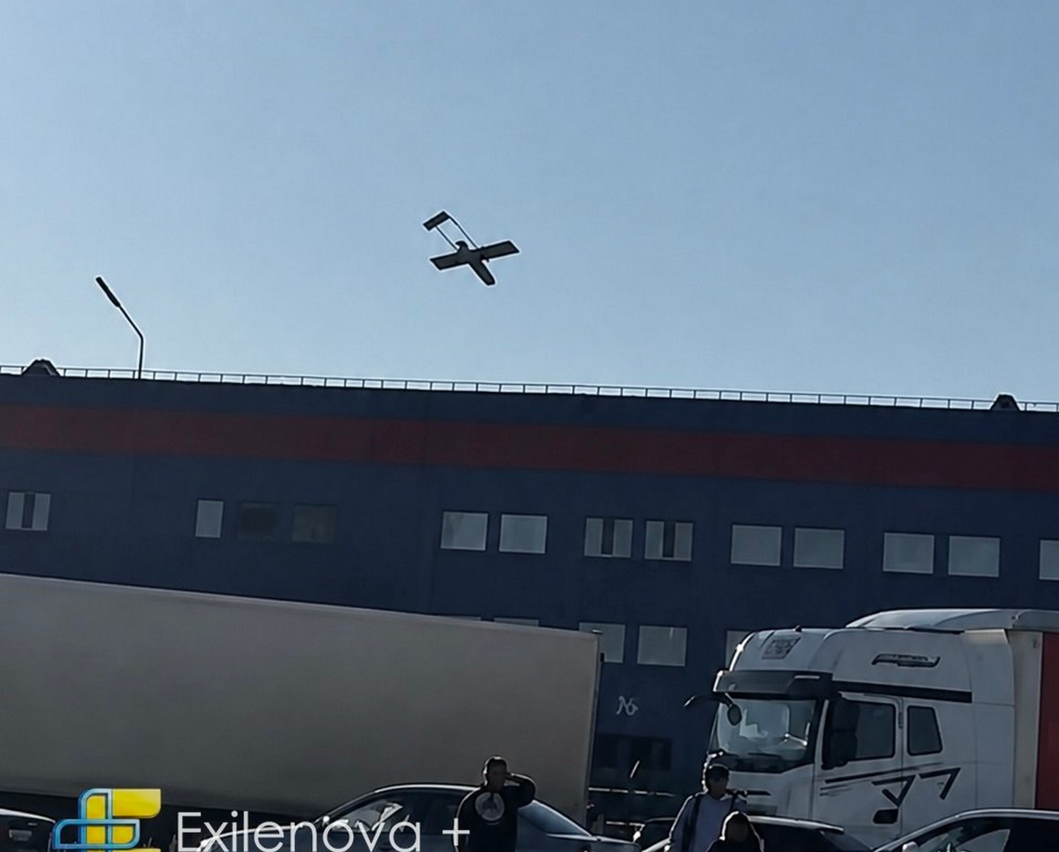one russian warehouse smolders near kazakhstan while bigger fire rages st petersburg · post ukrainian drone over ozon logistics complex orenburg russia 23 2026 fp-1 hitting ozone exilenova ukraine news