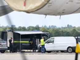 fifty grams hexogen ten days late what germany missed after attack ukraine's plane · post german police vehicles officers apron beneath wing ukrainian cargo aircraft leipzig/halle airport 2026 leipzig halle
