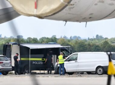 fifty grams hexogen ten days late what germany missed after attack ukraine's plane · post german police vehicles officers apron beneath wing ukrainian cargo aircraft leipzig/halle airport 2026 leipzig halle