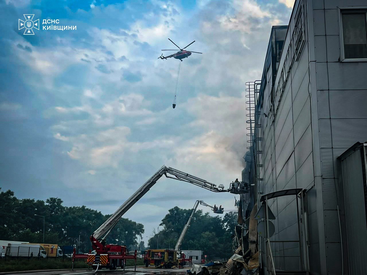 A Ukrainian helicopter is seen at the site of Russia's ballistic missile impact on 5 August 2026, in Kyiv Oblast. Source: State Emergency Service of Kyiv Oblast