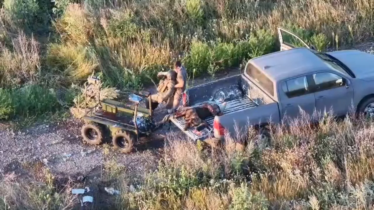Vladyslav Polskyi carries out two wounded soldiers, August 2026. Screenshot from video: Joint Forces Group