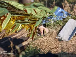two russian missiles hit post office shops kharkiv oblast killing 10 people · body lies covered site strike pechenihy regional dsns ukraine news ukrainian reports