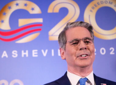 US Treasury Secretary Scott Bessent speaks in front of a G20 Asheville 2026 backdrop.