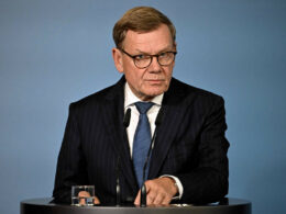 German Foreign Minister Johann Wadephul stands behind a lectern during a press conference.