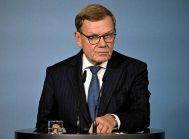 German Foreign Minister Johann Wadephul stands behind a lectern during a press conference.