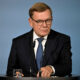 German Foreign Minister Johann Wadephul stands behind a lectern during a press conference.